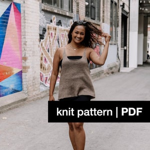 May include: A woman wearing a brown knit top with a square neckline and black shorts. The image includes the text "knit pattern | PDF" in a black rectangle. The woman is walking down a city street.
