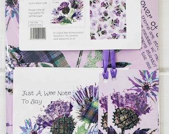 May include: A gift wrap, notecard, and tag set featuring a Scottish thistle design. The set includes two sheets of gift wrap, a notecard and envelope, and two gift tags. The gift wrap is 50x70 cm and the notecard and envelope are 12.5x12.5 cm. The set is printed on high-quality FSC certified paper.