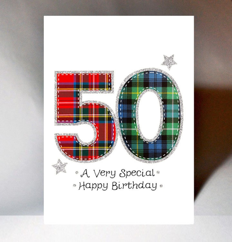May include: A white card with a red and green plaid number 50. The number is outlined in silver glitter. The card also has two silver glitter stars and the text "A Very Special Happy Birthday".