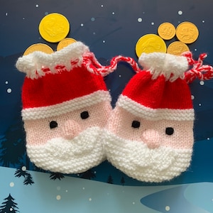 May include: Two knitted Santa Claus gift bags with white trim and red hats. The bags are filled with gold coins.