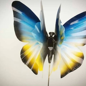 Blue & Yellow Metal Butterfly Garden Stake: Whimsical Garden Decor