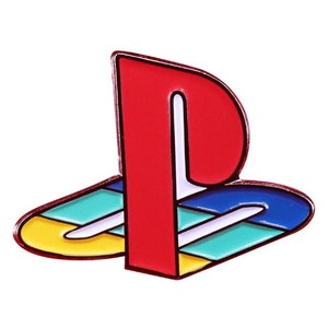 May include: A PlayStation logo enamel pin. The pin features a red 'P' shape with a white outline, and a base in blue, teal, yellow, and white. A bright and colourful accessory, reminiscent of the iconic gaming brand.