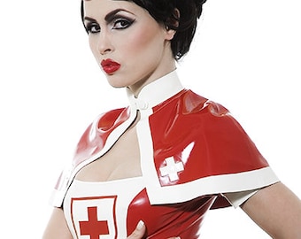 May include: A woman wearing a red and white latex nurse costume with a red cap and a white cross. She is standing with her hand on her hip and looking at the camera.