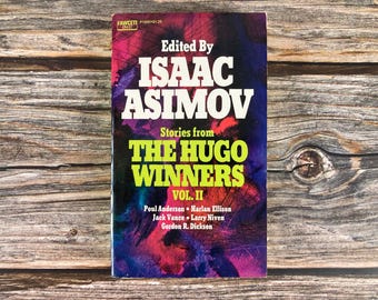 May include: A book cover with a colorful abstract design. The title is "The Hugo Winners, Vol. II" and the book is edited by Isaac Asimov. The authors include Poul Anderson, Harlan Ellison, Jack Vance, Larry Niven, and Gordon R. Dickson.