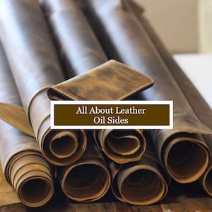 May include: Close-up of several rolls of brown leather with a rough, textured surface. The leather is rolled up and stacked on top of each other. The text "All About Leather Oil Sides" is displayed on a brown rectangle.