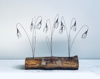 Wire snowdrops on waxed driftwood. Driftwood. Snowdrops. Flower Art. Mother’s Day. Valentines Day. Wire flowers. Snowdrops art.