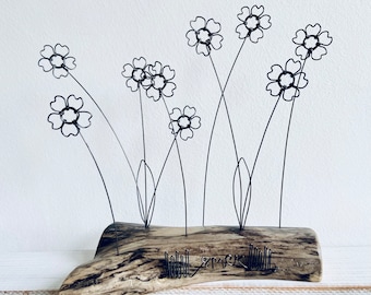 Wire forget me nots on waxed driftwood. Forever flowes. Driftwood art. Forget me nots. Mother’s Day. Valentines Day. Wire flowers.