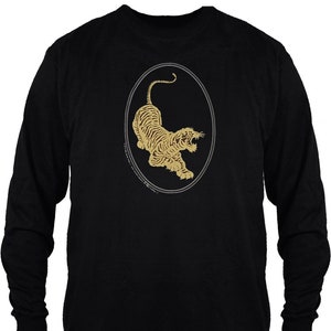 May include: Black long-sleeve t-shirt with a gold outline of a tiger in an oval on the front.