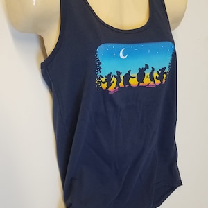 May include: A navy blue tank top with a graphic of a group of dancing bears silhouetted against a sunset and night sky with a crescent moon.