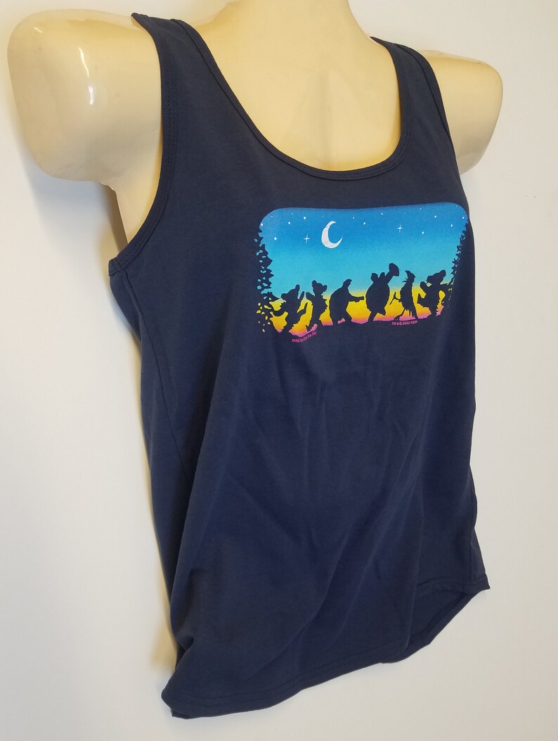 May include: A navy blue tank top with a graphic of a group of dancing bears silhouetted against a sunset and night sky with a crescent moon.