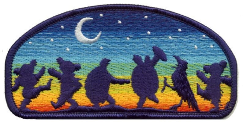 May include: Embroidered patch with a colorful night sky background and a crescent moon.  Silhouettes of dancing bears and a bird are in the foreground.