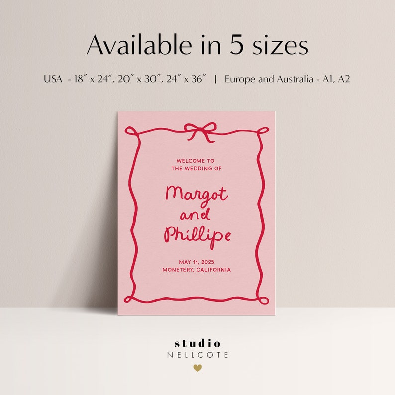 May include: Pink wedding invitation with a red border and a red bow. The text reads "Welcome to the wedding of Margot and Phillipe, May 11, 2025, Monterey, California". The bottom of the invitation reads "studio NELLCOTE".