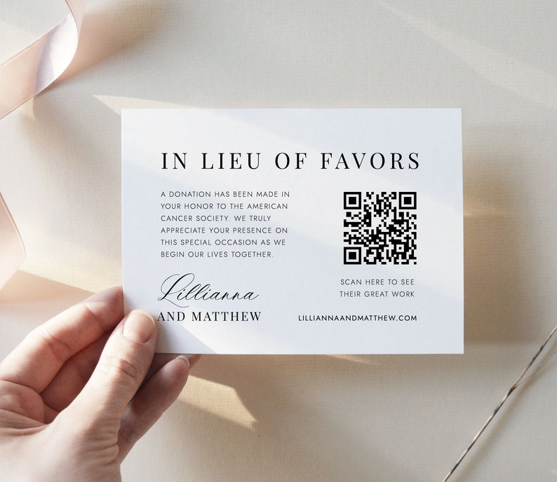 May include: A white card with black text that reads "In Lieu of Favors". The text explains that a donation has been made to the American Cancer Society in honor of the couple's wedding. A black and white QR code is included with the text "Scan here to see their great work" and the website "lilliannaandmatthew.com".