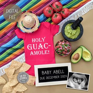 May include: A red onesie with the text "HOLY GUAC-AMOLE!" on it. A sombrero, a bowl of salsa, a bowl of guacamole, two avocados, and a sign that says "BABY ABELL DUE DECEMBER 202X" are arranged around the onesie.