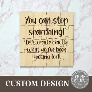 May include: A wooden puzzle with the text "You can stop searching! Let's create exactly what you've been looking for!" in black script. The puzzle is made of light-colored wood and has a custom design.