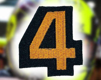 May include: A black and orange embroidered patch with the number "4" in the center.