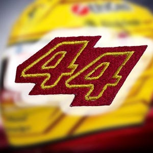 May include: Red and gold embroidered patch with the number 44.