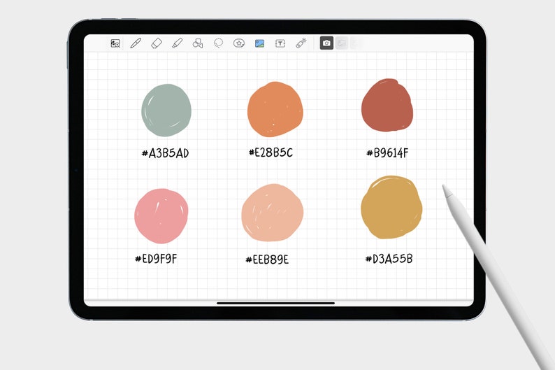 May include: A digital tablet screen displaying six different colored circles with their corresponding hex color codes. The circles are drawn in a hand-drawn style. The tablet is on a white surface with a white stylus next to it.