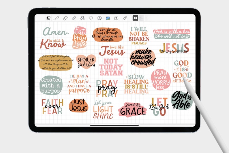 May include: A digital planner page with colorful stickers featuring inspirational quotes and bible verses. The stickers are on a grid background with a white stylus.