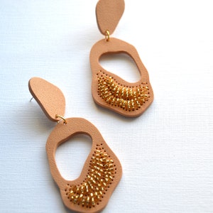 Sparkly statement earrings in organic shapes Handcrafted large earrings embroidered in beads Gold