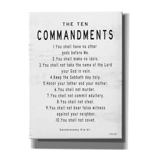 May include: A white wood sign with black text listing the Ten Commandments. The text includes the verse Deuteronomy 5:6-21.