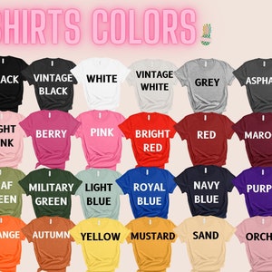 May include: A display of t-shirts in various colors, including black, white, pink, red, and blue. The text "SHIRTS COLORS" is at the top. Each shirt is labeled with its color name, such as "BLACK," "PINK," and "BLUE."