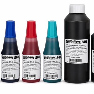 May include: A collection of six bottles of Premium Quick Drying Ink 809 in various colors. Four smaller bottles have colored caps in black, blue, red, and turquoise. Two larger black bottles have white caps and labels with barcodes and text.