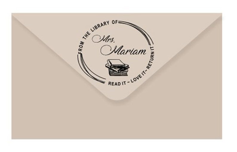 May include: A black and white stamp with the text "From the Library of Mrs. Mariam Read it - Love it - Return it" and a stack of books.