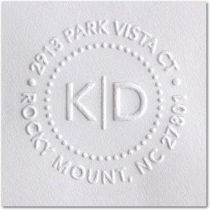 May include: A white round return address stamp with the text "2913 Park Vista Ct. Rocky Mount, NC 27801" and the initials "K|D" in the center.