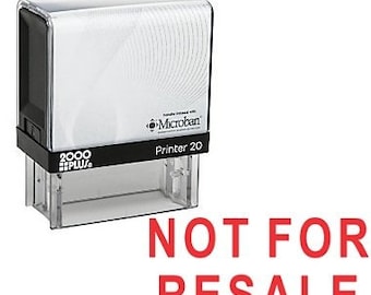 Könnte beinhalten: Ein schwarzer und transparenter Stempel aus Kunststoff mit Selbsttinte, auf dem "Printer 20" steht und ein Logo mit der Aufschrift "Microban" in Weiß. Der Stempel ist mit "2000 PLUS" gekennzeichnet und hat einen roten Abdruck mit der Aufschrift "NOT FOR RESALE".