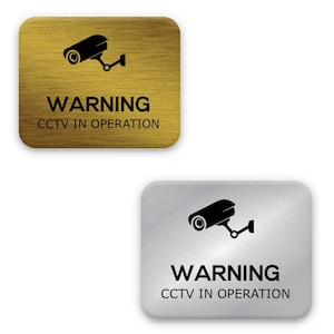 Warning: CCTV in Operation Sign – 3.5 x 4.3 Inches, Silver & Gold Plastic Laminate with Camera Image, Durable and Weatherproof