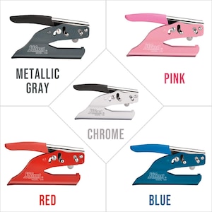 May include: Five self-inking stamps in different colours, each with the text "Shiny Model-EM". The colours are metallic grey, pink, chrome, red and blue.