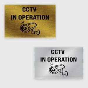 CCTV in Action Sign – 10 x 6.5 Inches, Silver & Gold Plastic Laminate, Durable Weatherproof Surveillance Camera Warning Sign for Home Office