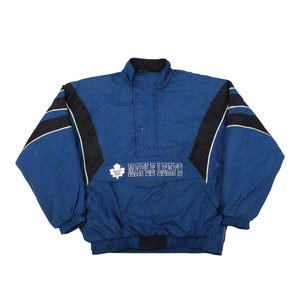 May include: A set of three ceramic mugs with a speckled, matte finish. The mugs are in shades of cream, light gray, and dark gray. Each mug has a simple, minimalist design and a rounded handle.