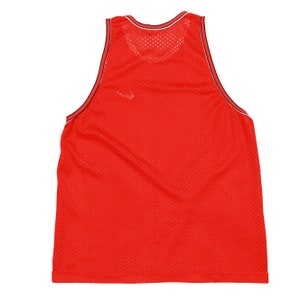 May include: Red mesh tank top with black and white trim around the neck and armholes.