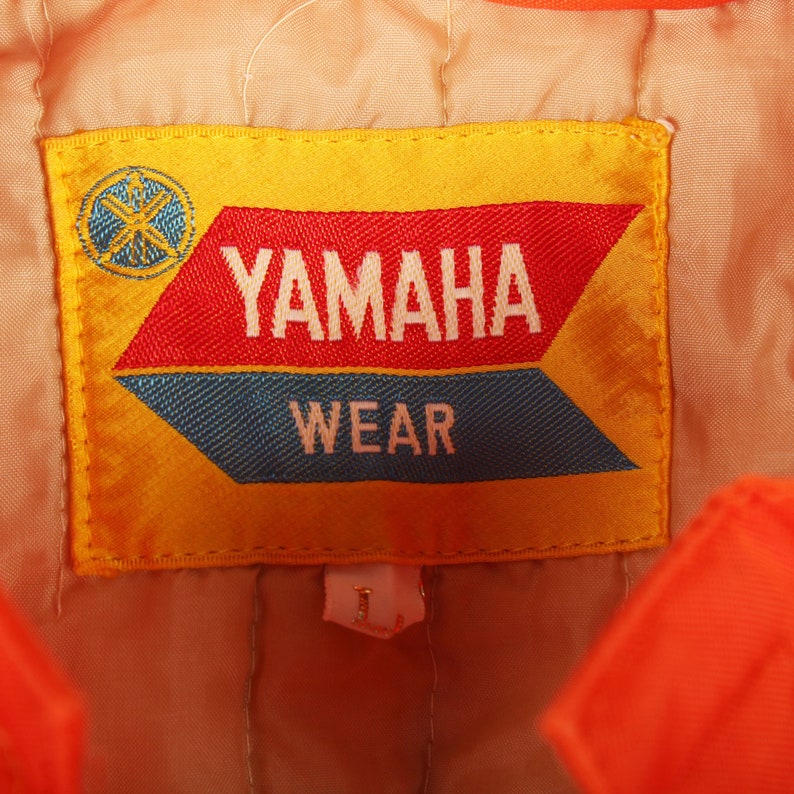 Retro winter coat , Yamaha sports jacket , Motorsports vintage jacket , Collectible racing jacket , Yamaha logo jacket , Retro Yamaha clothing , Vintage snow coat , 80s Yamaha fashion , Yamaha snowmobile wear , Classic motorsports jacket