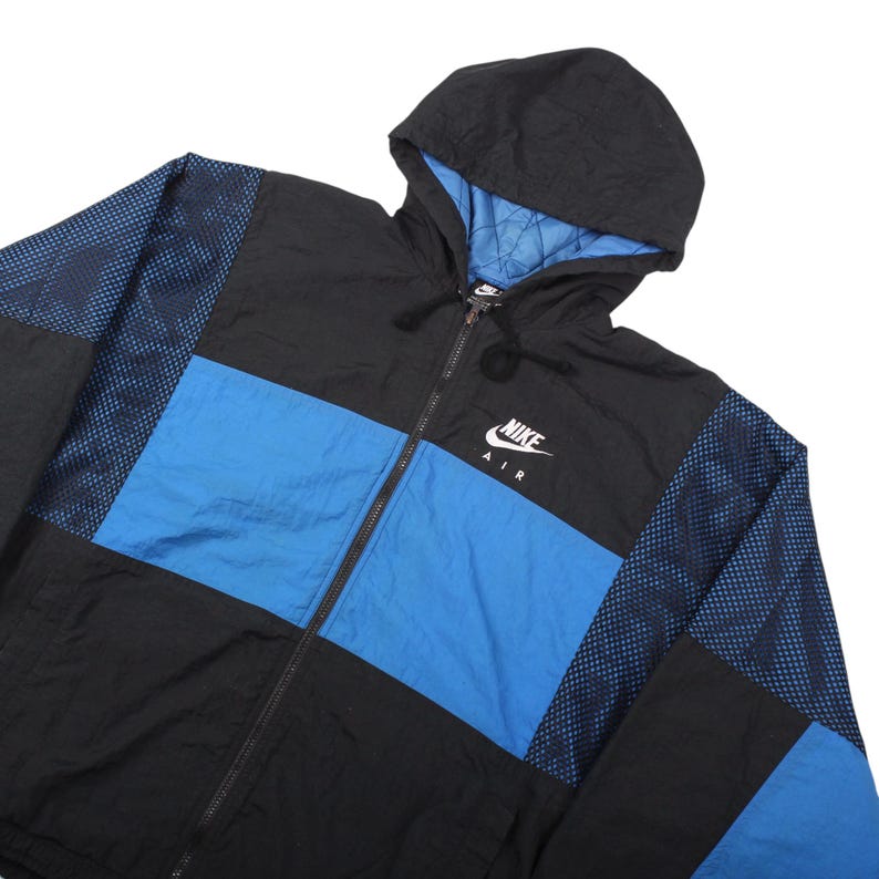 vintage cold weather jacket , rare vintage nike , nike air hooded , vintage swoosh jacket , retro puffer jacket , black blue puffer , y2k sportswear , streetwear puffer , vintage winter jacket , archive nike air , classic swoosh , padded windbreaker , urban streetwear jacket , old school sportswear , heavyweight nike jacket , 90s outerwear , casual winter streetwear , vintage logo jacket , collectible streetwear , nike air outerwear , heritage sports jacket , timeless nike piece