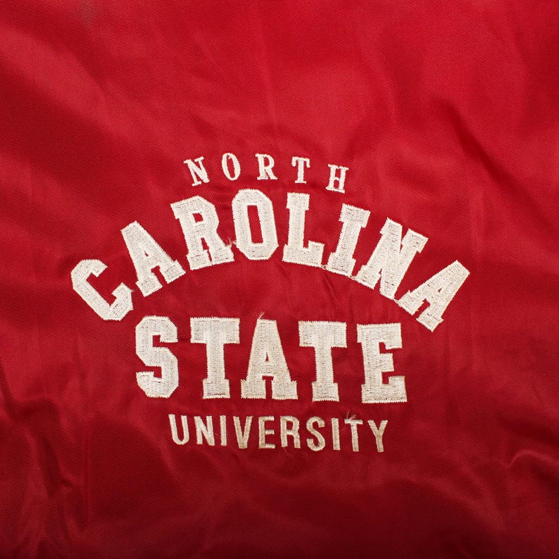 gift for alumni student, back to school outfit, high end thrift find, autumn layering basic, retro university look, classic americana clothing, cozy stadium wind shell, campus fashion trend, curated vintage boutique