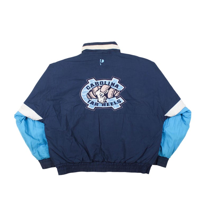 vintage unc tar heels jacket , north carolina windbreaker 90s , unc big logo jacket back , tar heels college jacket , ncaa vintage windbreaker , blue unc jacket mens , retro college sports jacket , unc fan jacket vintage , carolina tar heels jacket , 90s ncaa jacket , mens unc windbreaker , college team jacket vintage , unc streetwear jacket , vintage college jacket , tar heels logo jacket
