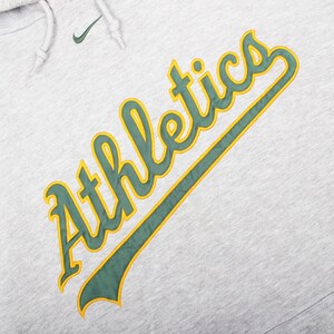 vintage athletic wear , mlb baseball fashion , nike swoosh hoodie , retro nike hoodie , vintage usa hoodie , streetwear mlb , oakland baseball hoodie , mlb nike sweatshirt , athletics fan hoodie , nike vintage mlb gear , oakland a’s fan gift , nike baseball fashion , vintage sports brand hoodie , nike mlb pullover , retro oakland hoodie , nike athletic hoodie , mlb oversized hoodie