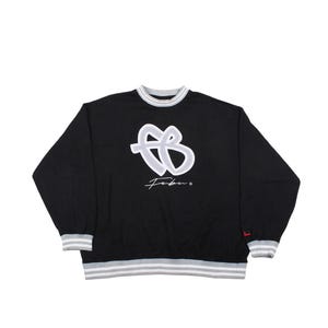 May include: Black sweatshirt featuring a white and grey design. The design includes a stylized letter "B" and the word "Febu" in a script font. The collar and cuffs have grey and white stripes. A small red logo is on the right cuff.
