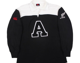 Camiseta de rugby vintage Canterbury All Blacks, polo de manga larga blanco y negro con el logo A grande