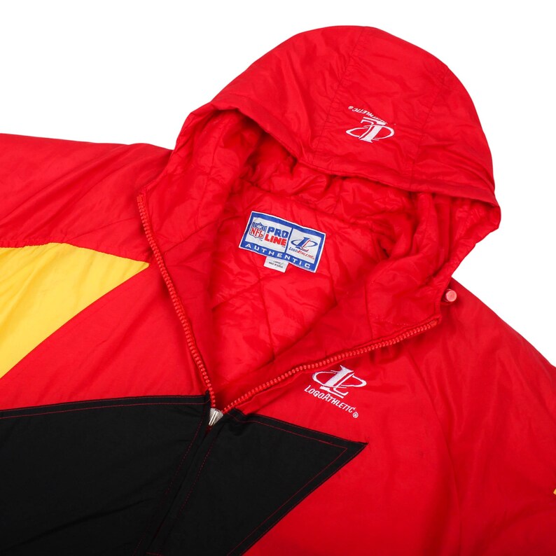 hooded puffer jacket, thick winter jacket, collectible vintage nfl, kansas city football, preowned sports jacket, thrifted nfl clothes, clean vintage puffer, warm gameday outfit, vintage coat with hood, authentic vintage streetwear, retro kc chiefs