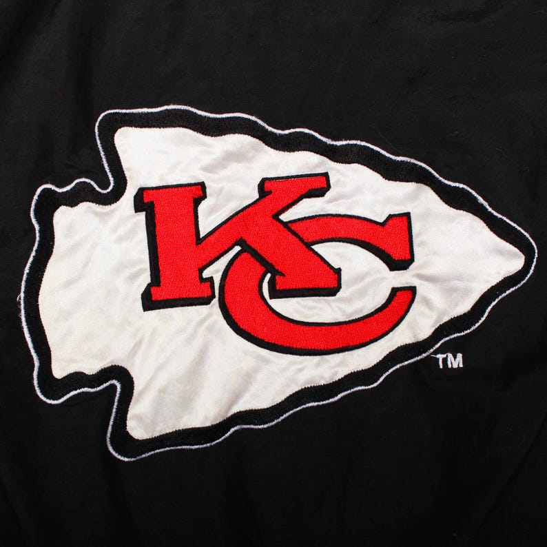 Vintage Starter jacket look, Apex One jacket alternative, Chalk Line vintage style, Nutmeg Mills apparel, Pro Player puffer jacket, Mitchell and Ness chiefs, Nike NFL vintage style, Patrick Mahomes aesthetic, Travis Kelce game day outfit, Super Bowl champion gear, Vintage varsity jacket, Bomber jacket red, Ski jacket vintage look, Cyber y2k puffer, Grunge sports aesthetic,