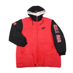 Vintage Nike Air red and black sherpa lined full zip hoodie jacket with large back logo and 90s streetwear design.