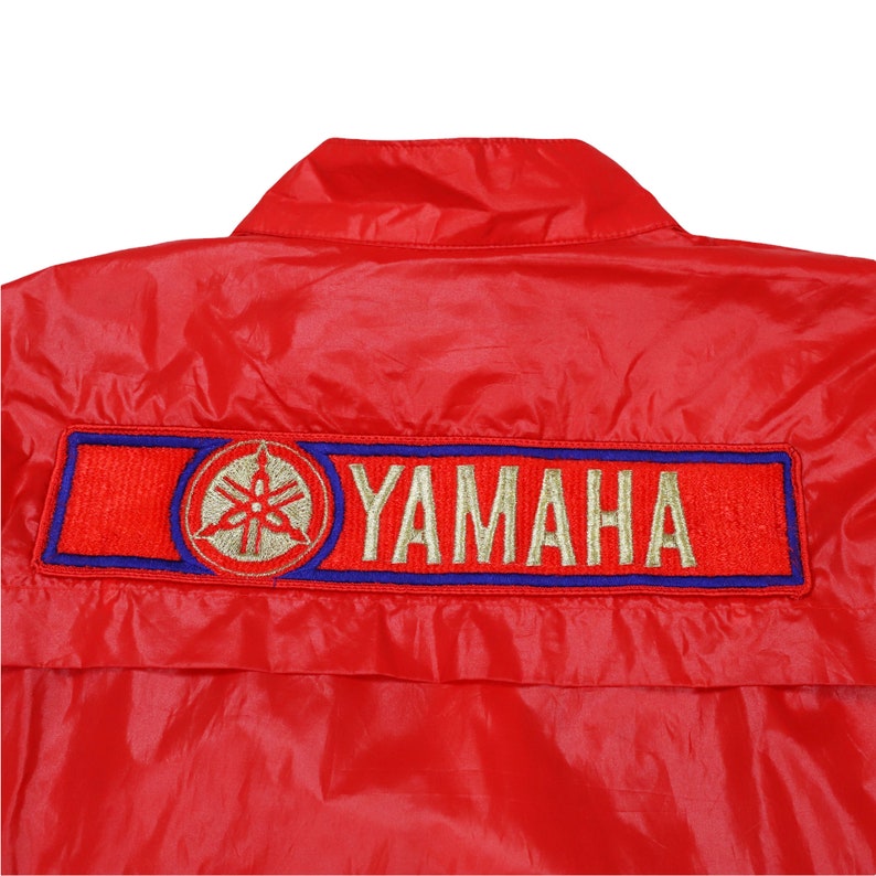 throwback Yamaha jacket , 1990s jacket , 90s outerwear , bold color jacket , moto fashion jacket , Yamaha team apparel , vintage Yamaha clothes , Yamaha pit crew jacket , red white blue jacket , 90s biker windbreaker , nylon zip jacket , unisex racing jacket , 90s motorsport gear , vintage racing fashion , motorcycle nylon jacket , retro team jacket , Yamaha logo jacket , 90s Yamaha team gear , Yamaha racing fashion