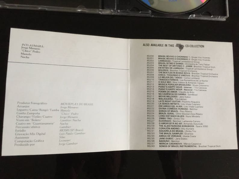 May include: A white CD booklet with text in Portuguese and English. The booklet lists the songs on the CD and the musicians who played on the album. The text on the front of the booklet reads "INTI-AYMARA" and "MOVIEPLAY DO BRASIL".