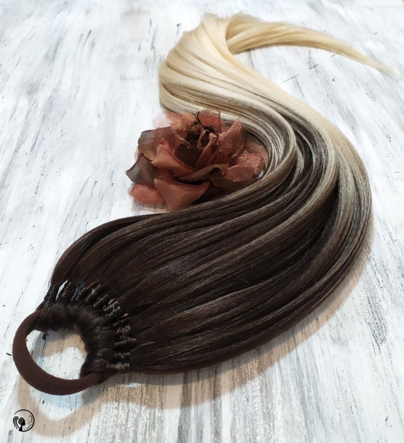 Brown to blonde ombre straight ponytail Brown to blonde ombre straight ponytail
