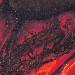 May include: A close-up of a red fabric with a black crown of thorns on top. The fabric is textured and the thorns are painted in a dark brown color.