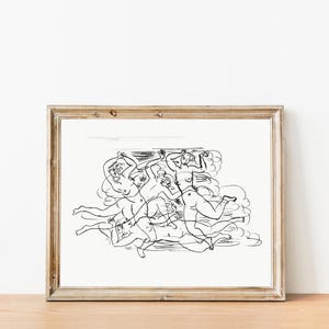 May include: A framed print with a black and white line drawing of multiple figures in motion. The artwork shows several nude figures in a dynamic, flowing composition, suggesting movement and energy. The frame is a light brown colour.